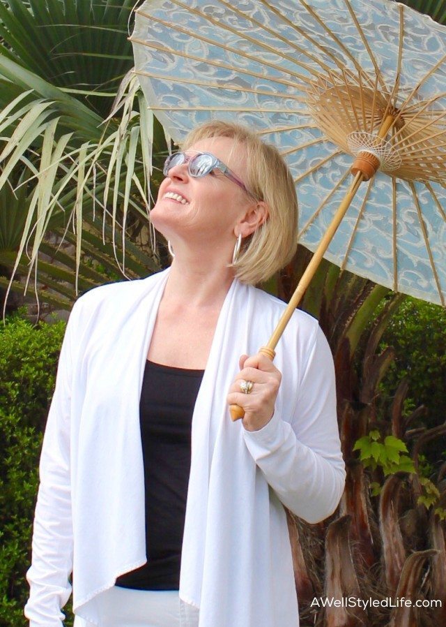 Elegant Sun Protection involves sun protective clothing and parasols with 50+ UPF