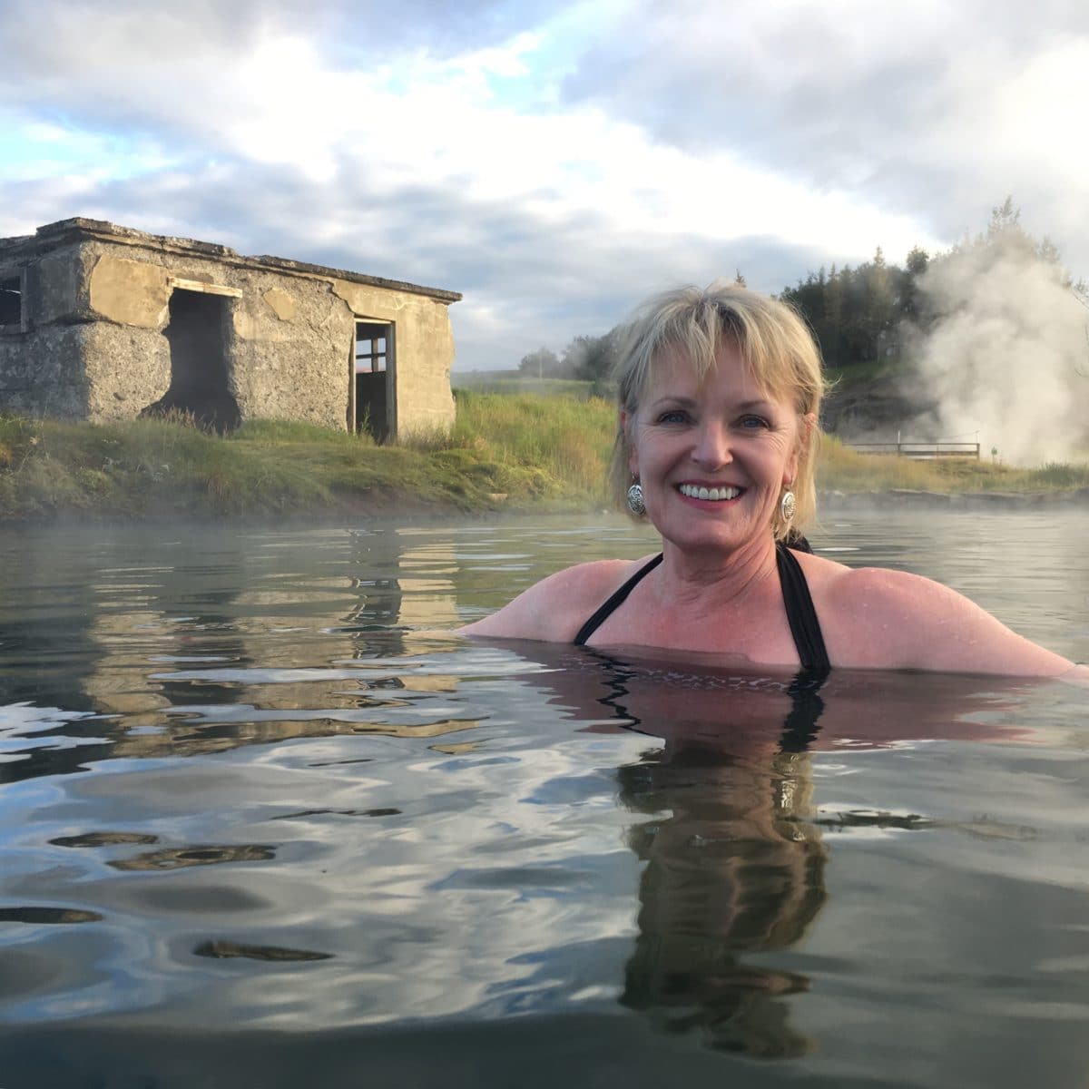 Jennifer Connolly of A Well Styled Life soaking in Secret Lagoon Iceland