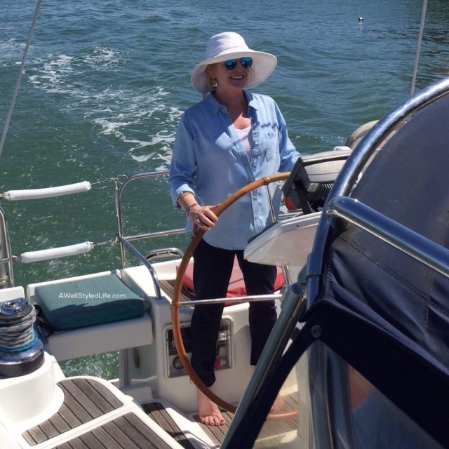 At the helm of a sailboat