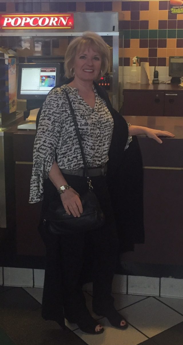 Loading up on popcorn before going in to the movie