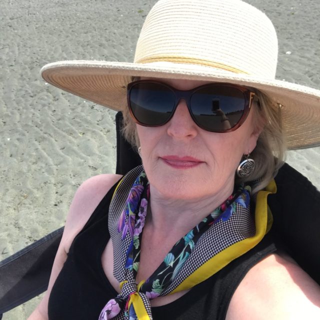 wearing a hat for sun protection