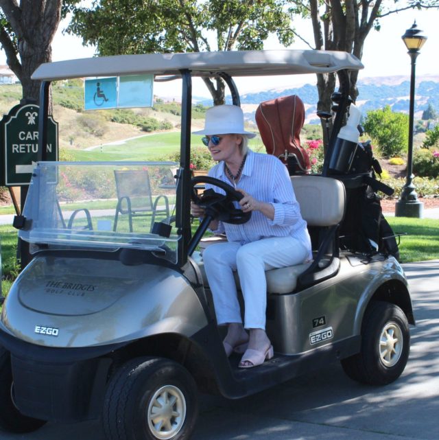 Jennifer Connolly of A Well Styled Life in a golf cart