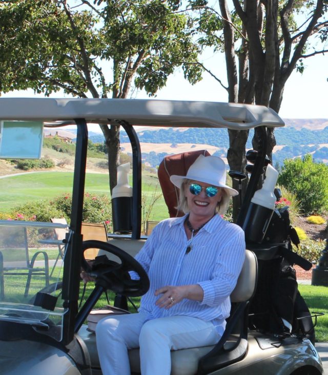 Jennifer Connolly of A Well Styled Life in a golf cart