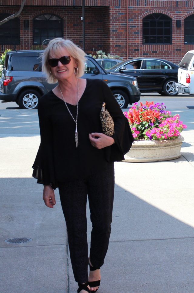 Jennifer Connolly of A Well Styled Life wearing bell sleeved top and slim pants