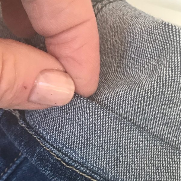 inside of hemmed jeans with original hem