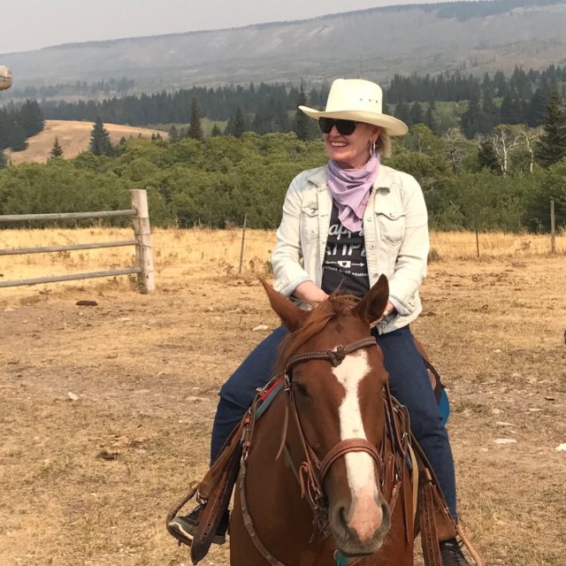 Jennifer Connolly of A Well Styled Life riding a horse in Montana