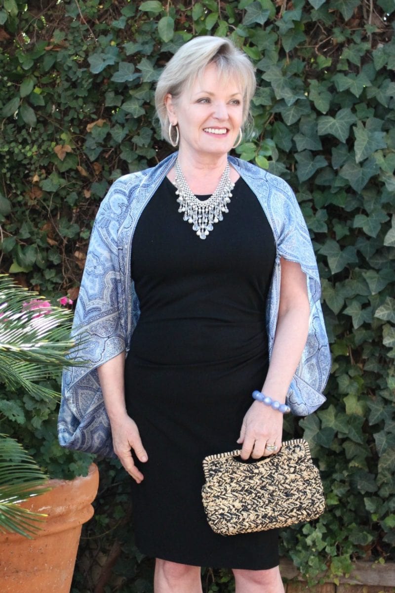 Jennifer Connolly of A Well Styled Life wearing black dress with blue accessories