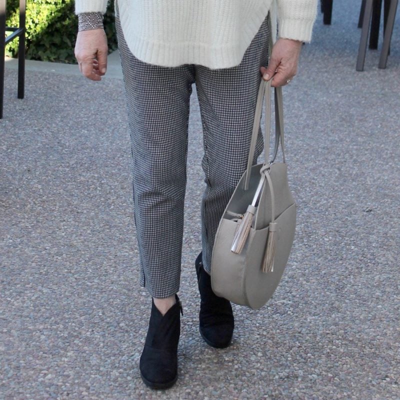 Jennifer Connolly of A Well Styled Life wearing houndstooth pants from Ann Taylor and black booties