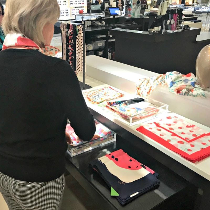 Jennifer Connolly of A Well Styled Life shopping silk scarves at Nordstrom
