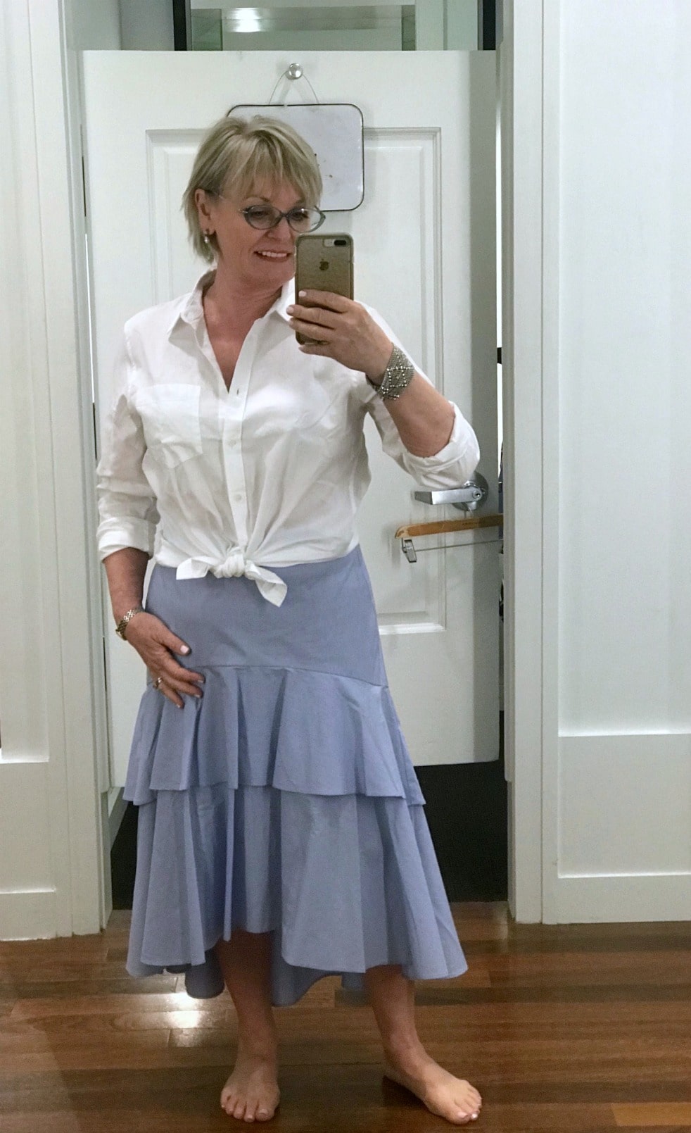 Jennifer Connolly of A Well Styled Life wearing high low flutter skirt from Banana Republic