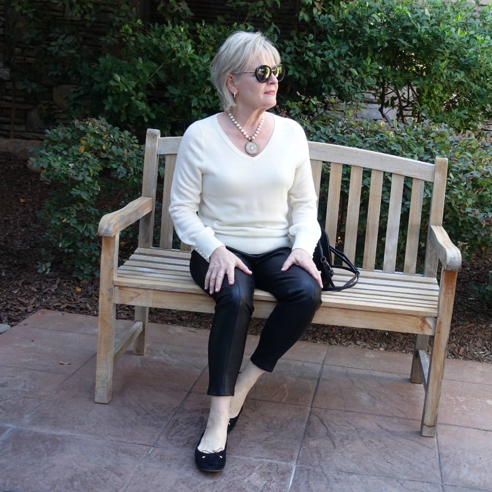 Jennifer Connolly of A Well Styled Life wearing faux leather leggings from Ann Taylor