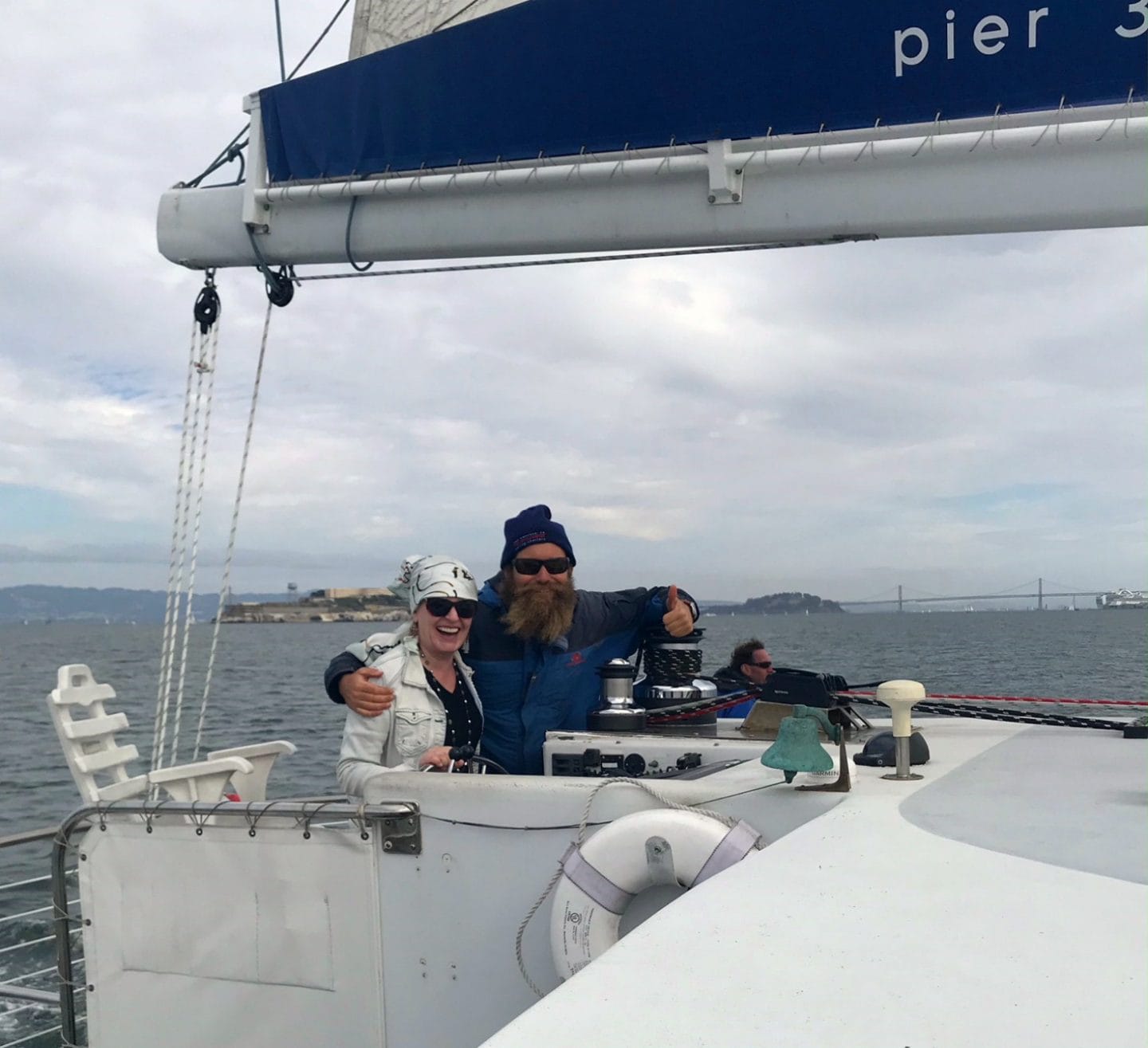 at the helm of the Adventure cat