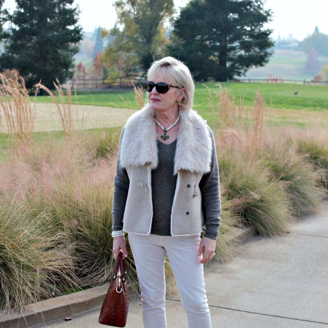 style blogger jennifer connolly wearing beige faux fur with neutral accessories