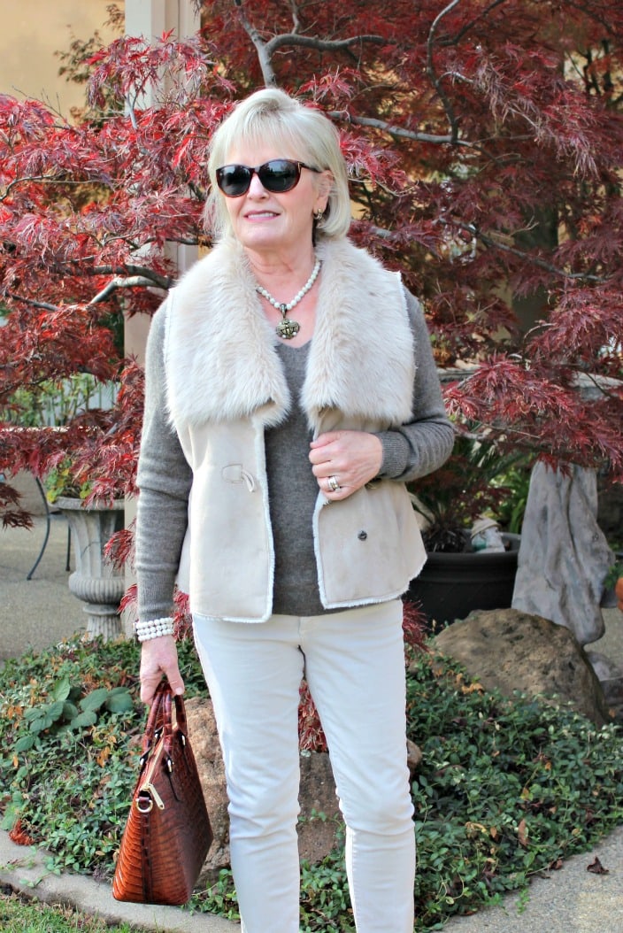 jennifer connolly wearing column of beige with faux fur vest