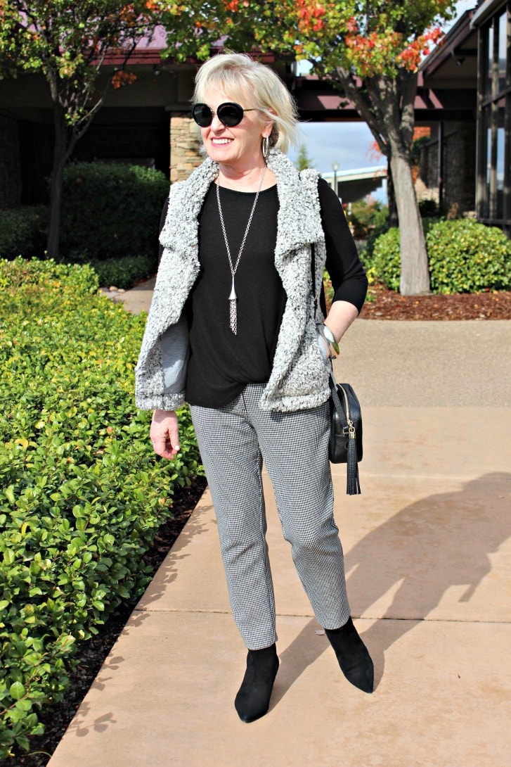 jennifer connoly of a well styled life wearing gray asymetrical vest over black and white checked pants