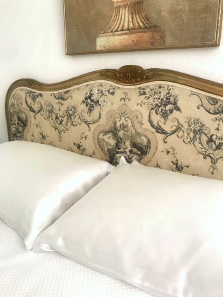 ivory silk pillow cases from Lilysilk on antique bed from France