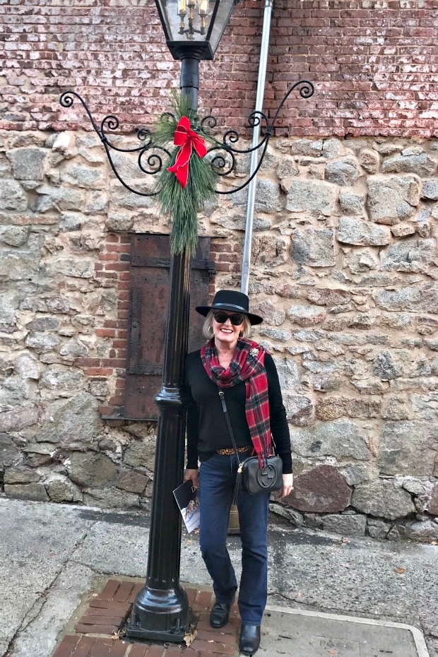 Jennifer Connolly of A well Styled life in black fedora, plaid scarf and jeans