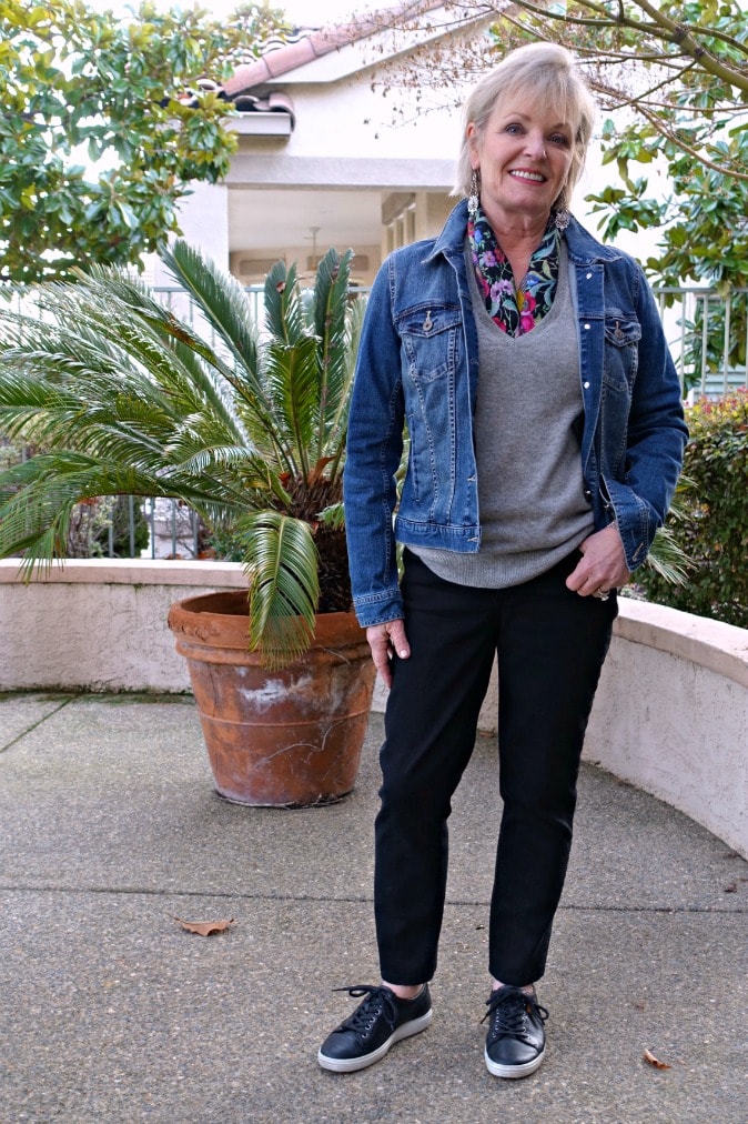styling a sweater and jeans with denim jacket a neck scarf