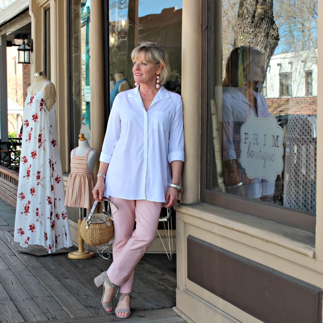 Jennifer of A Well Styled Life wearing pink pants with white shirt and taupe sandals