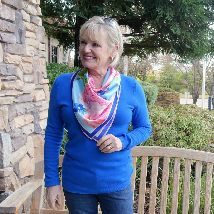 silk scarf tied as a triangle on Jennifer Connolly