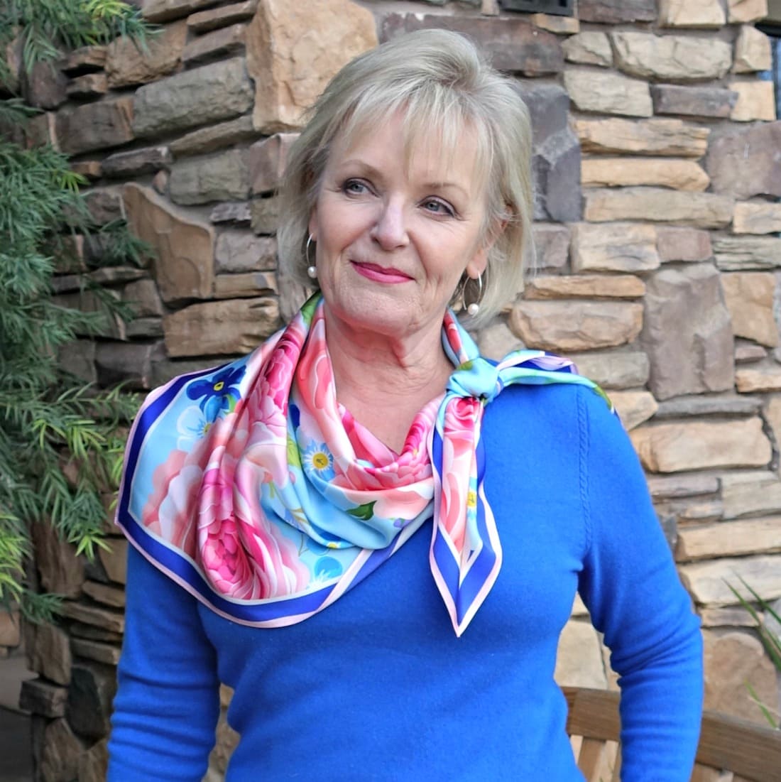 Jennifer Connolly showing different ways to tie a square silk scarf