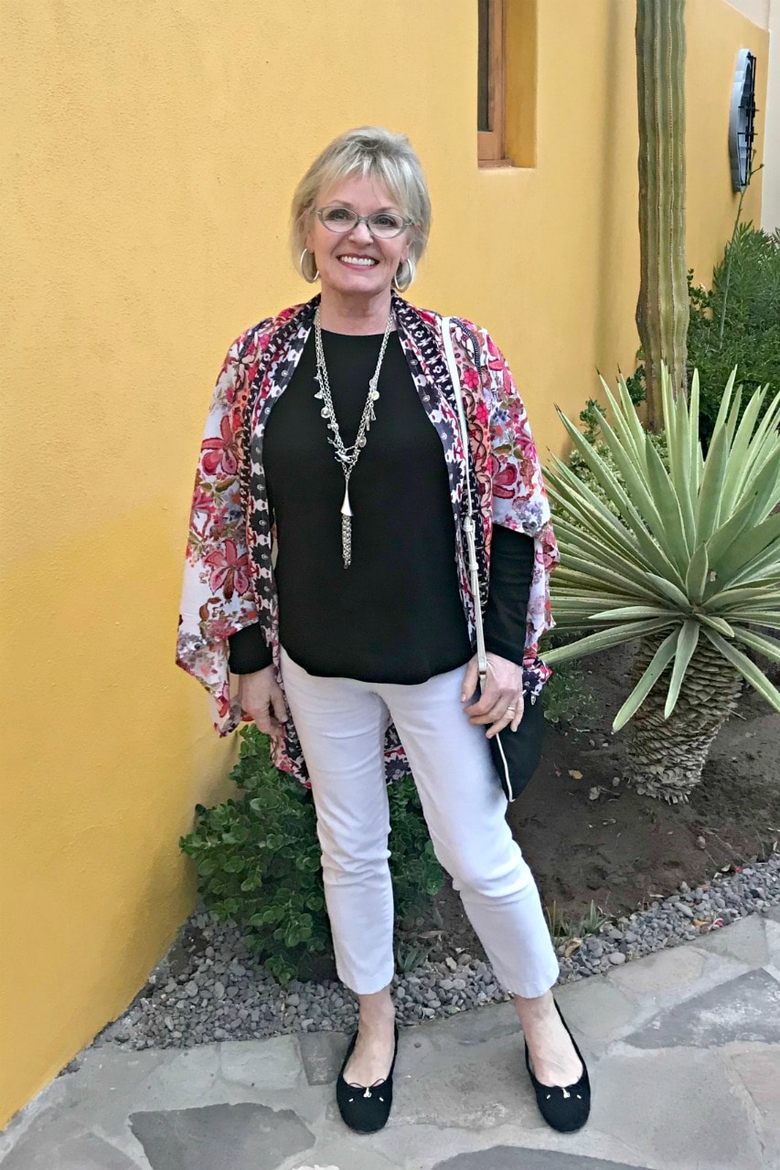 Jennifer Connolly wearing colorful wrap over black and white outfit in Loreto Bay Mexico