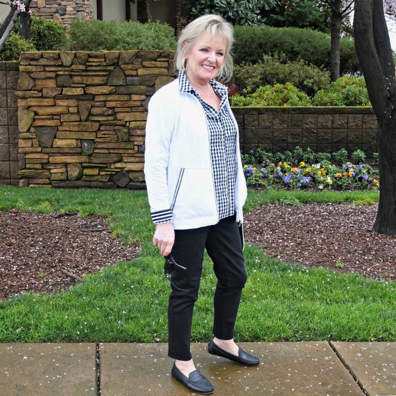 Jennifer of A Well Styled life wearing Talbots gingham shirt, never fade black jeans and black driving moccasins