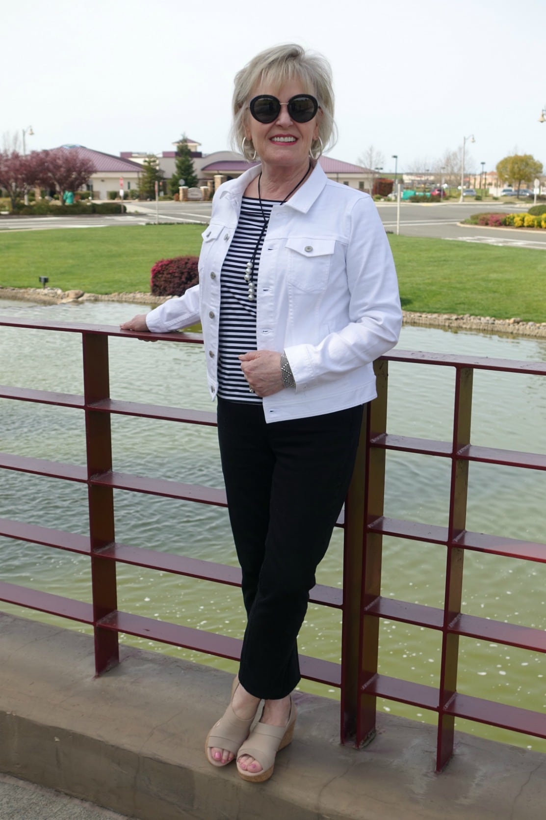 style blogger Jennifer Connolly wearing Clarks wedges with black jeans and white denim jacket