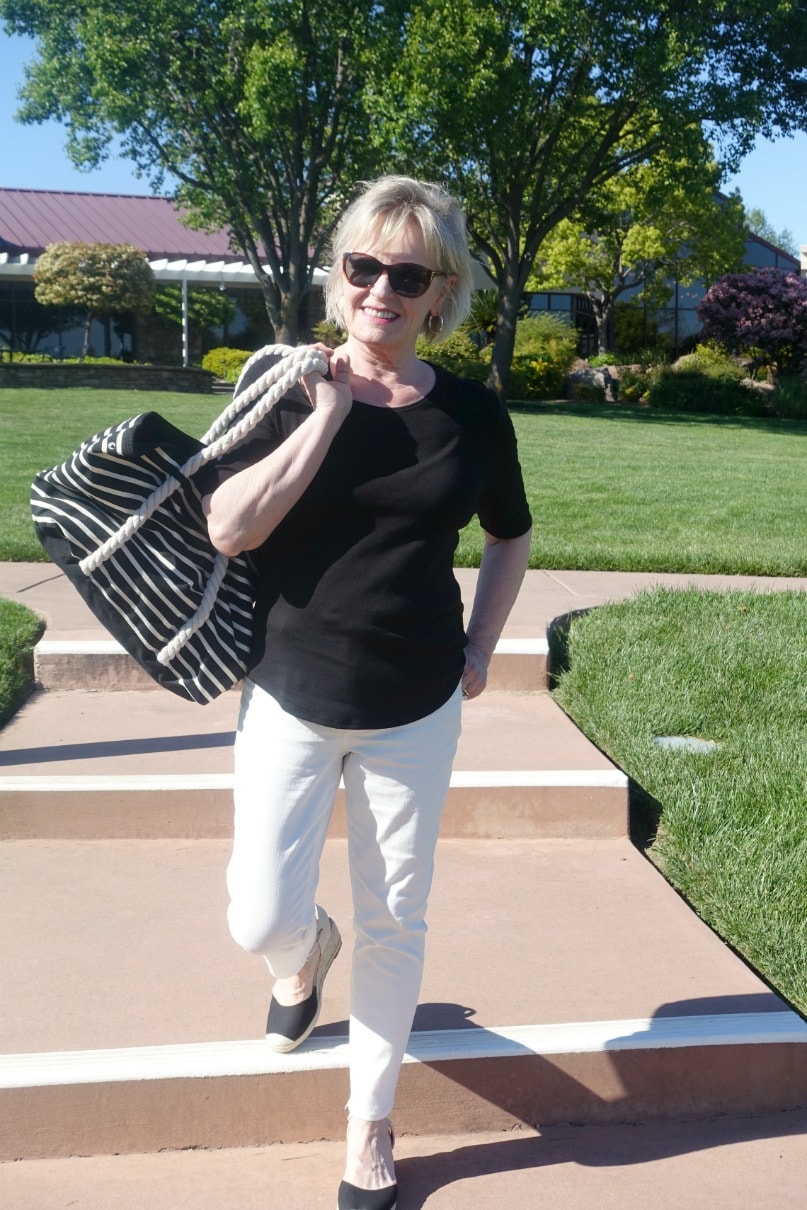 black and cream striped tote bag from Walmart styled with black tee and cream colored jeans on Jennifer from A Well Styled Life