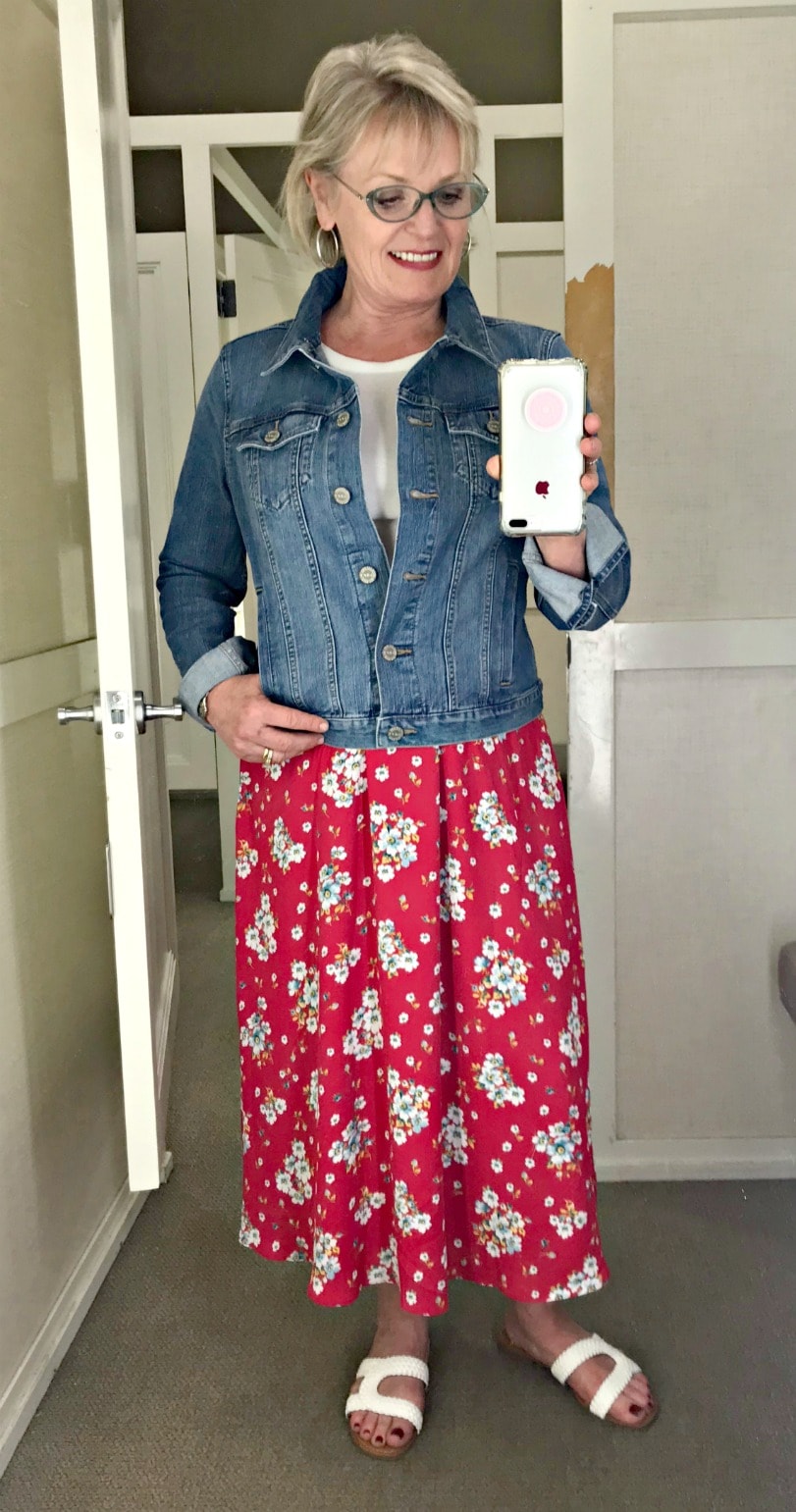 Jennifer Connolly of A Well Styled Life wearing floral skirt with denim jacket from Loft
