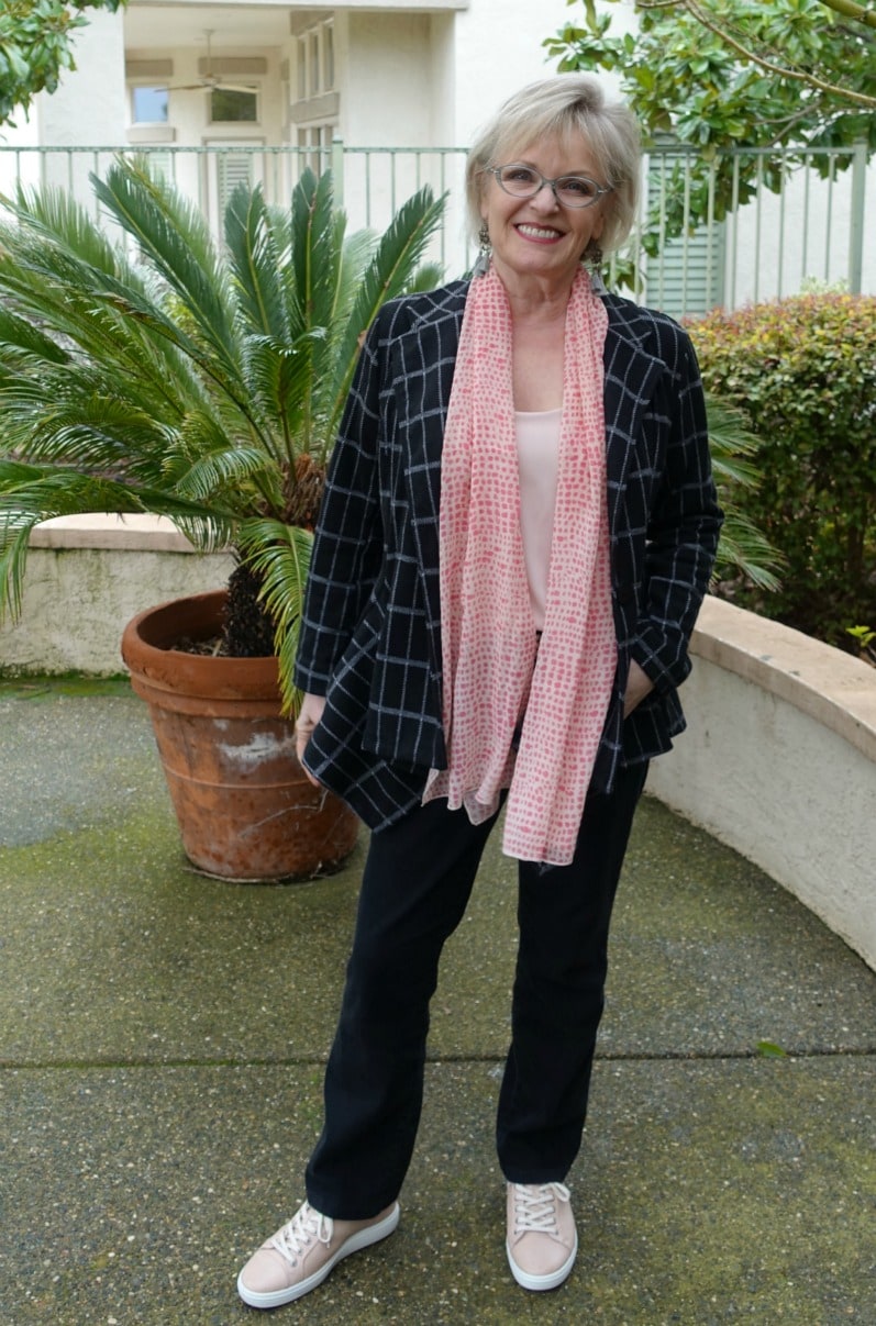 Jennifer Connolly of A Well Styled Life wearing plaid blazer, black jeans and blush colored top