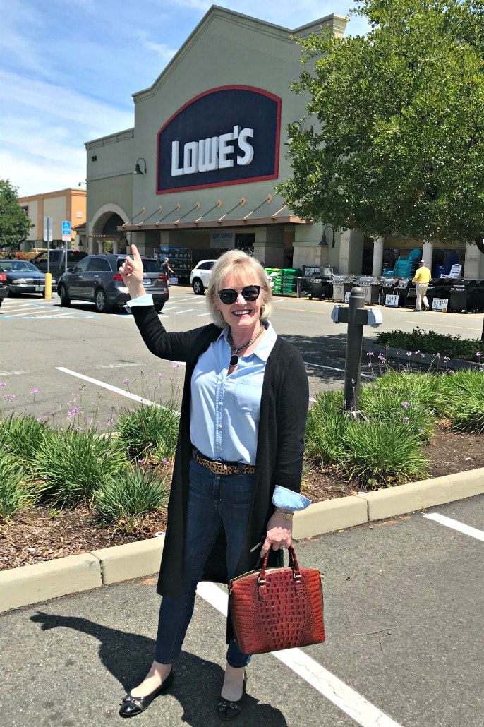 Jennifer Connolly of A Well Styled Life outside Lowes wearing black duster sweater over denim shirt and jeans