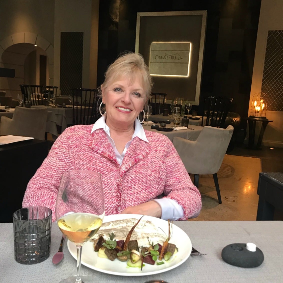 Jennifer Conneatting at the Caviar and Bull restaurant in Budapestolly of A Well Styled Life