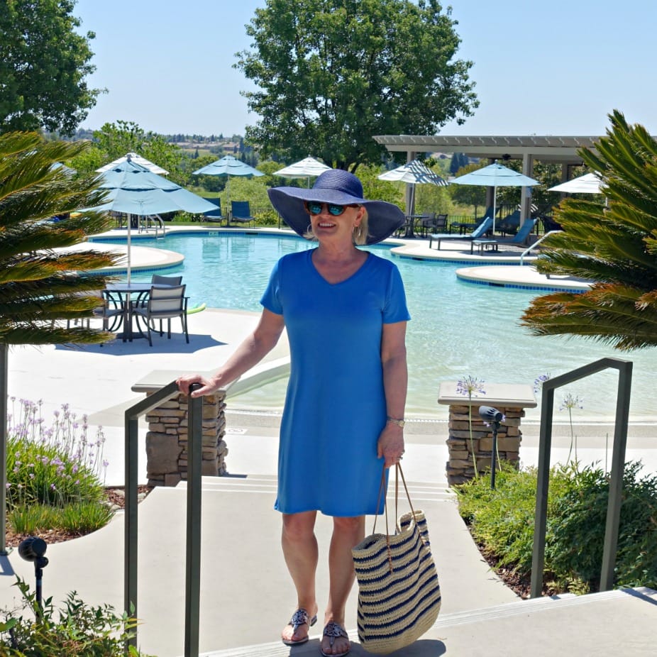 Jennifer Connolly of A Well Styled Life wearing casual cotton dress and floppy hat from Walmart