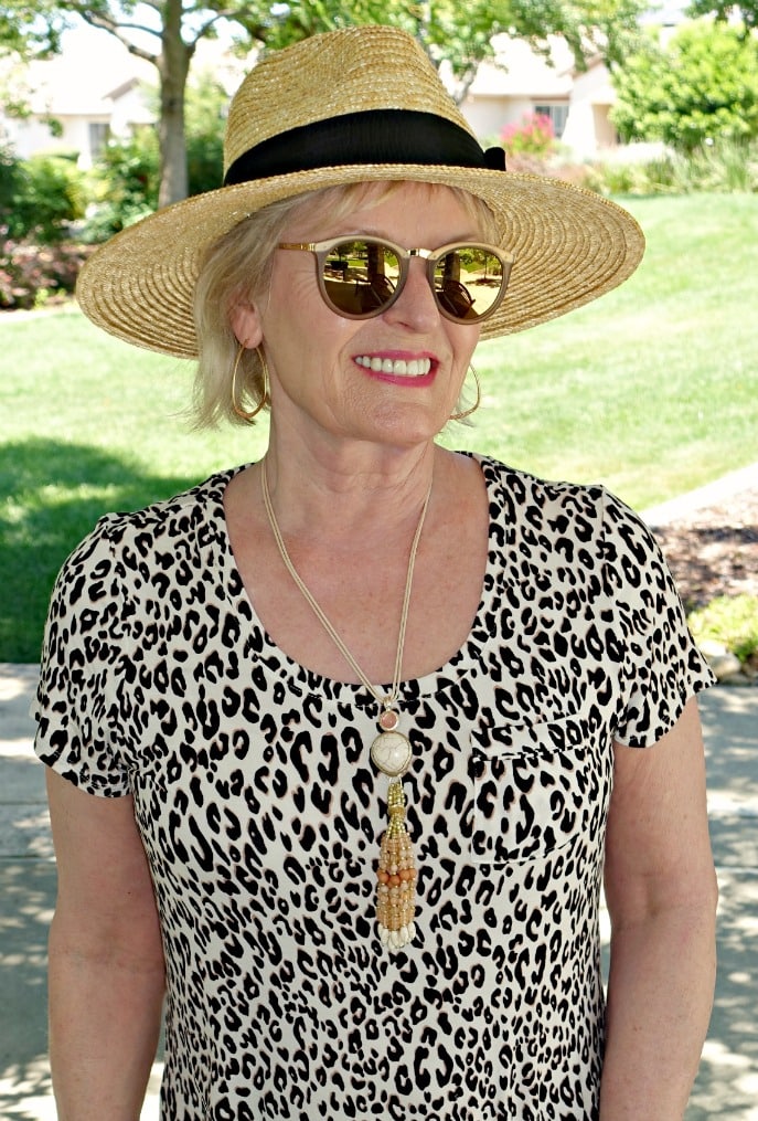 Jennifer Connolly of A Well Styled Life wearing straw hat from Nordstrom and leopard from Soma