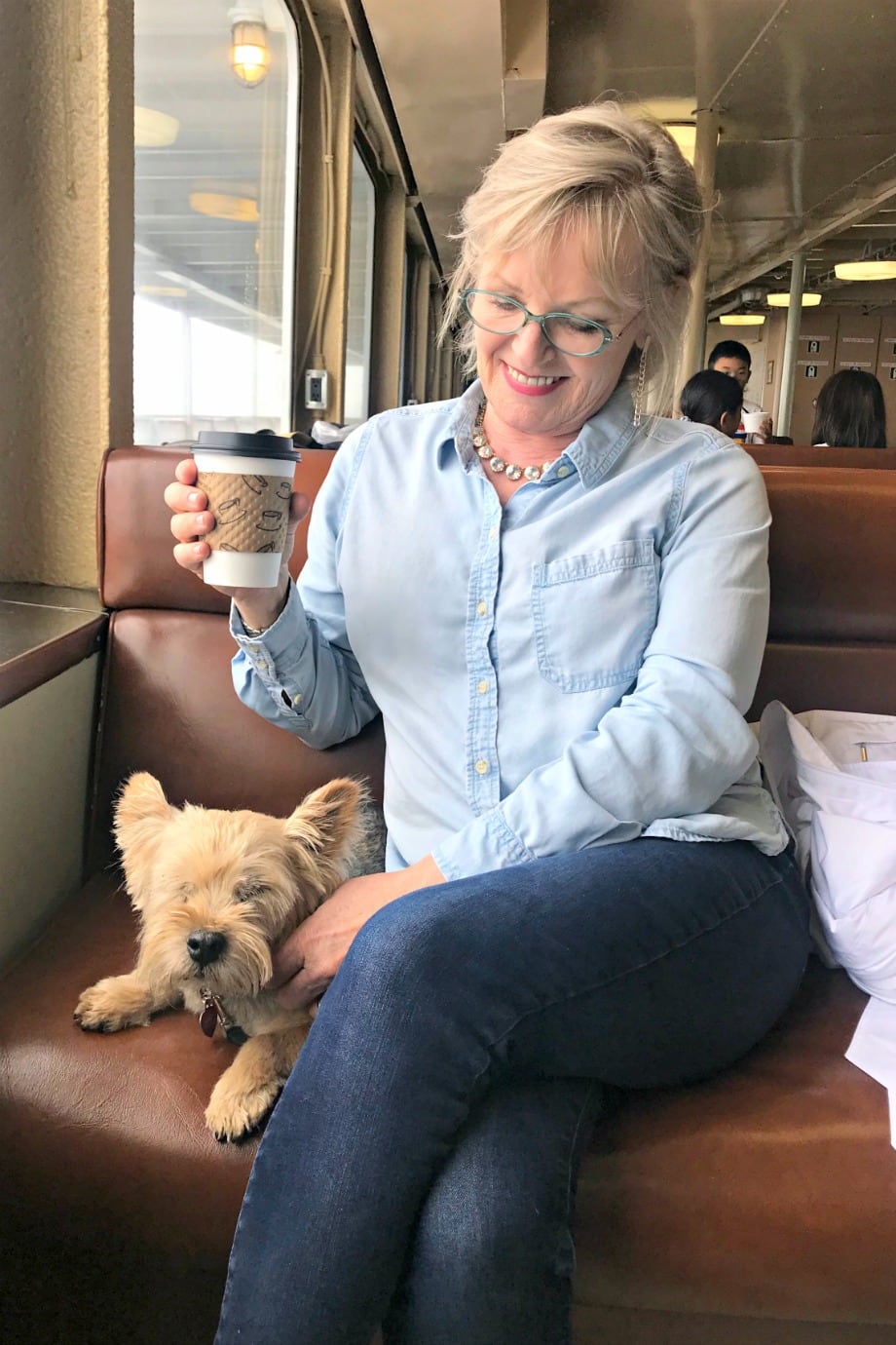 Jennifer Connolly of A Well Styled Life on the Black Ball Ferry Ferry wearing chambray shirt and blue jeans