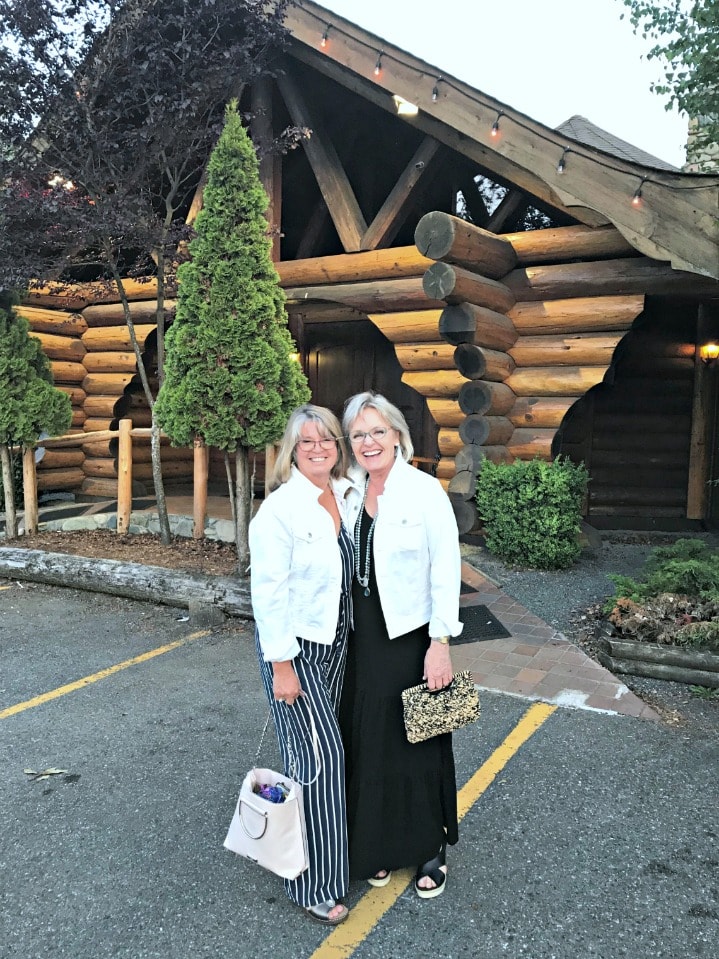 Jennifer Connolly and her sister-in-law wearing white denim jackets over jumpsuit and maxi dress