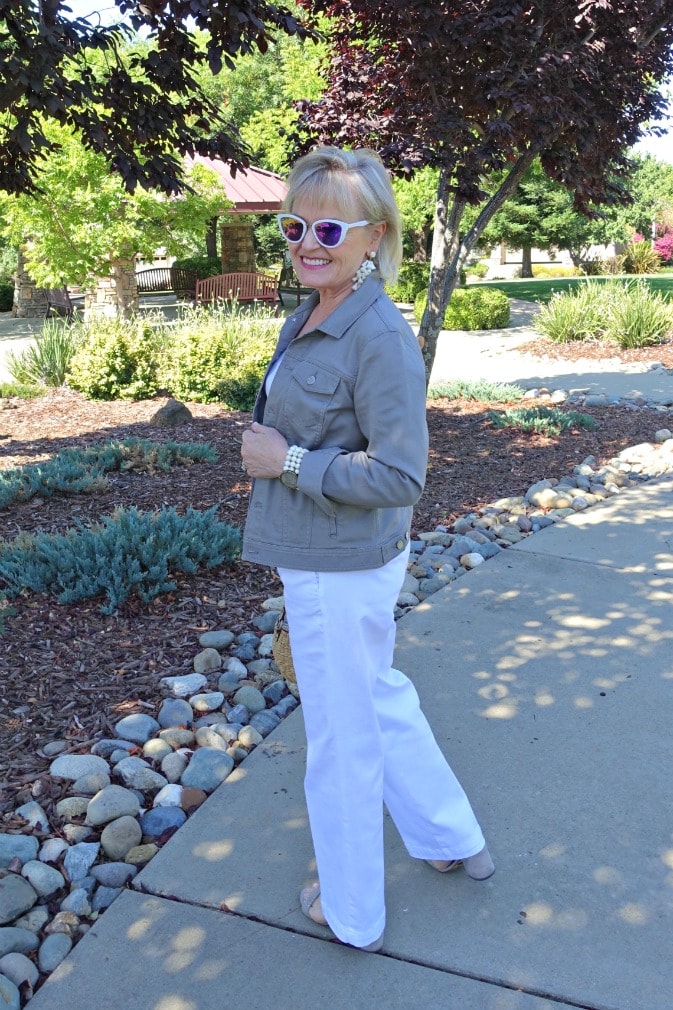 Jennifer Connolly of A Well Styled Life wearing casual look of white trouser jeans ans gray denim jacket from Talbots