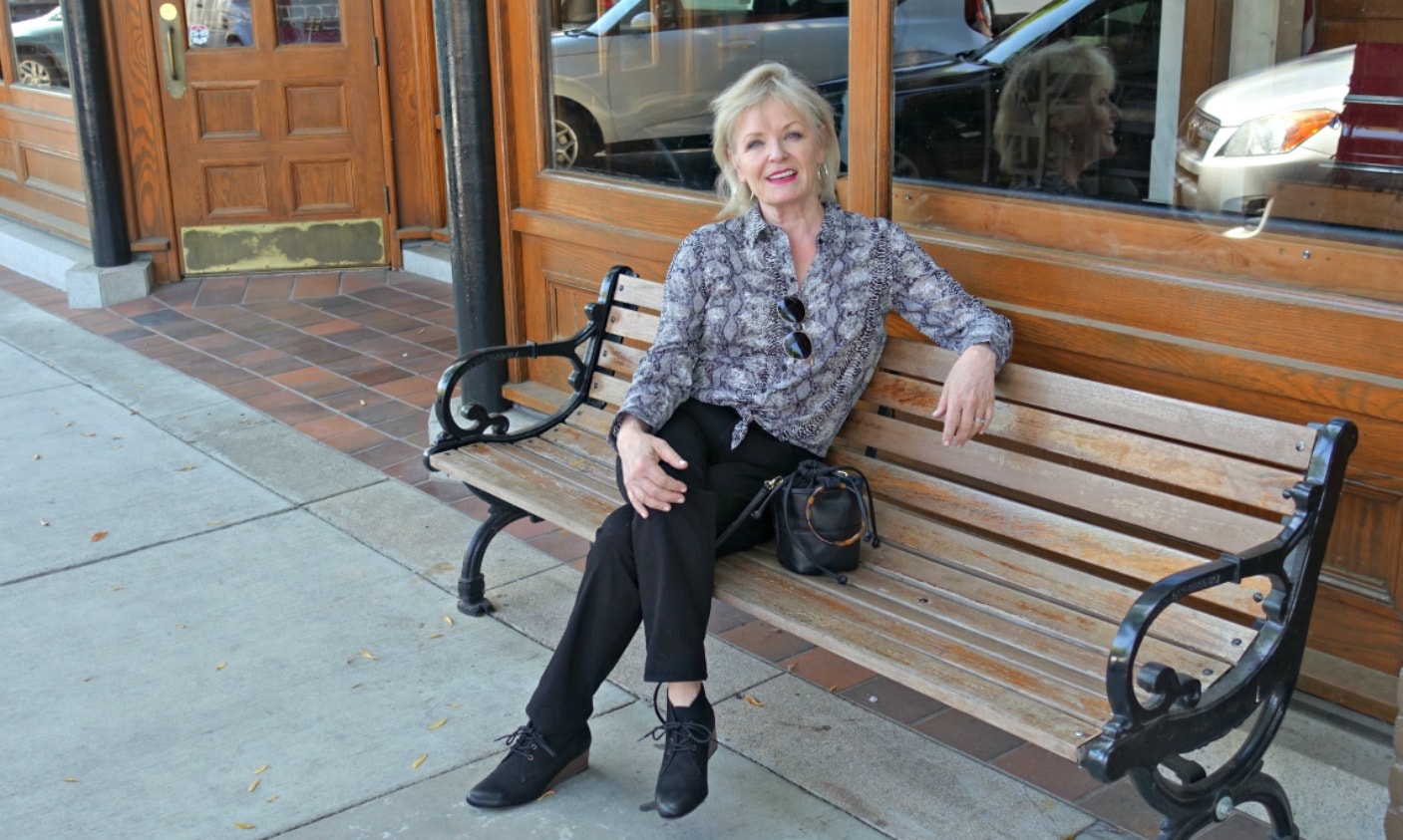 casual wedge booties in vegan suede and black jeans with snake print blouse