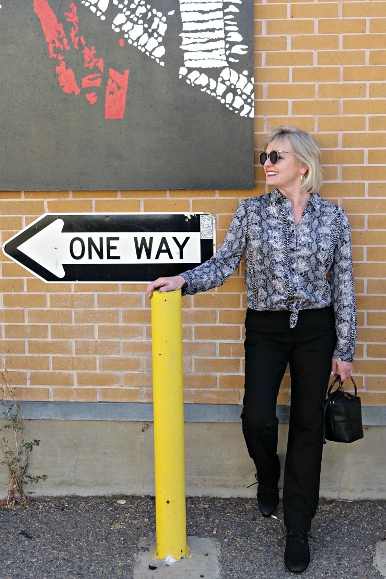 Jennifer Connolly of A Well Styled Life styling black and white snake print blouse and black jeans from Walmart