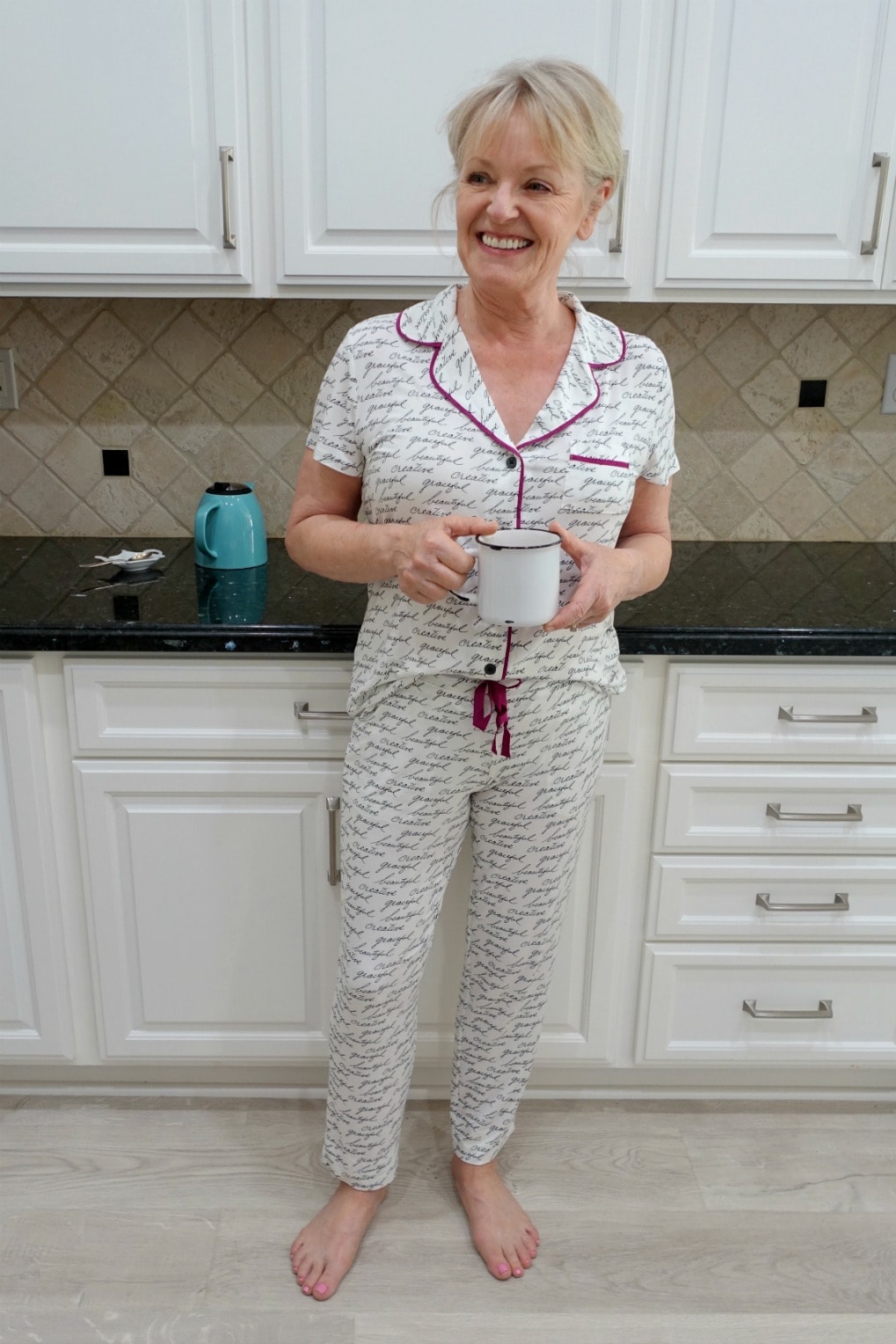 Jennifer Connolly of A Well Styled Life wearing Soma Cool Nights pajamas in her white kitchen