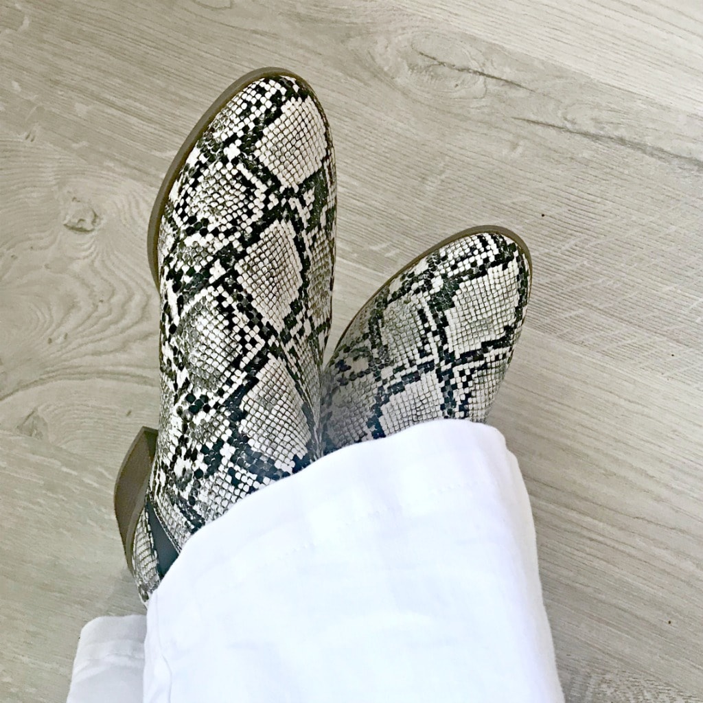 snakeskin booties worn with white jeans on A Well Styled Life