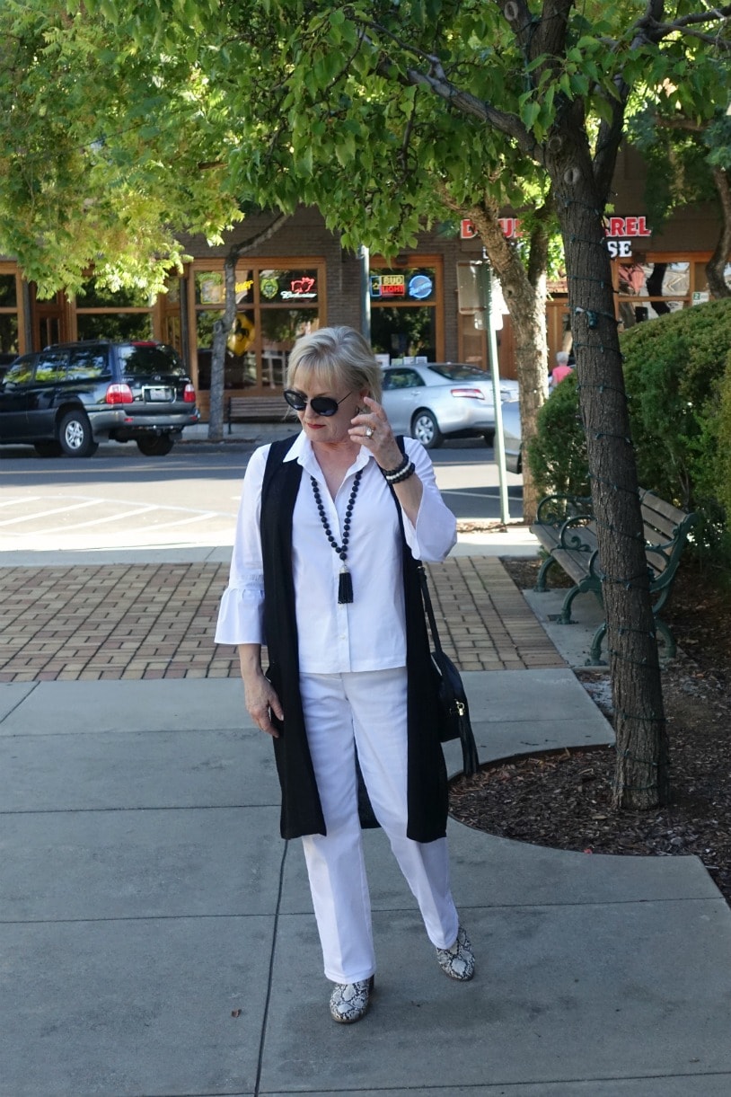 Jennifer Connolly of A Well Styled Life wearing tassel necklace and tassel bag