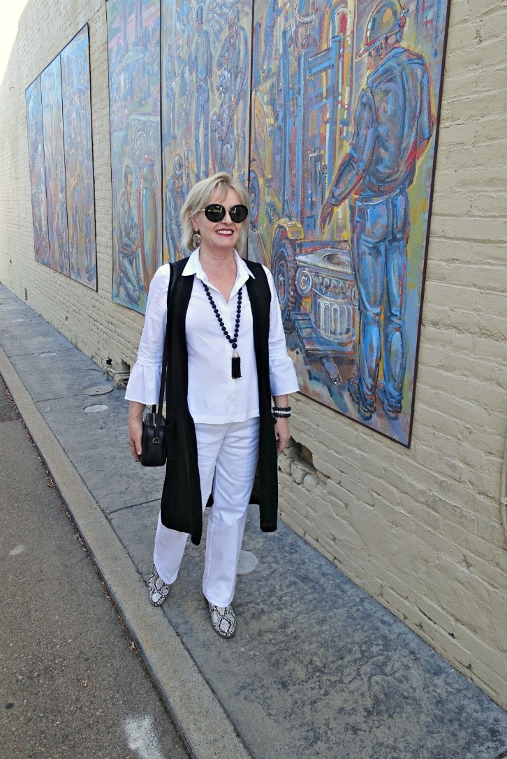 Jennifer Connolly wearing column of white with black linen vest