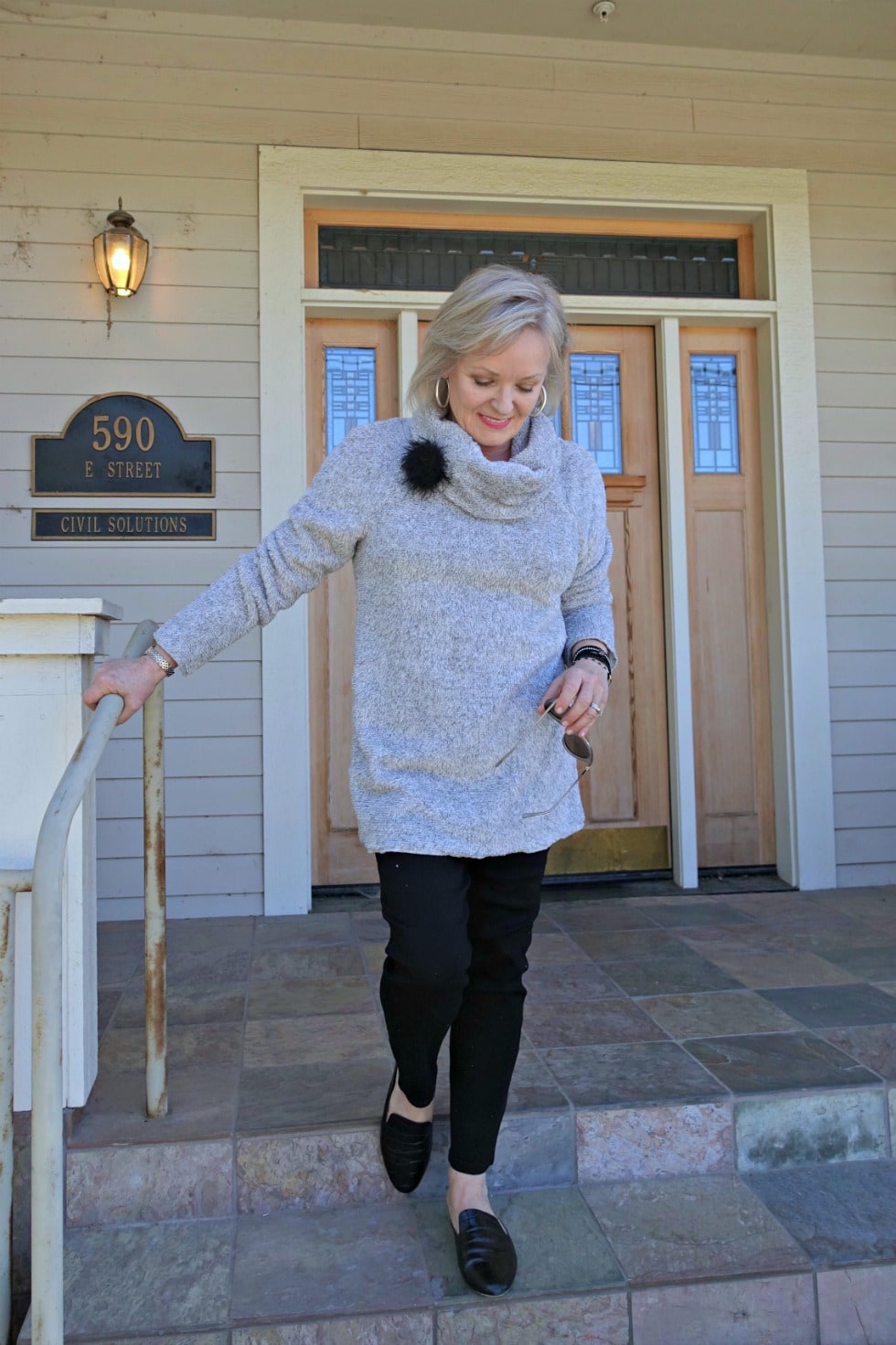 Jennifer Connolly of A Well Styled Life Life wearing fuzzy gray fleece over black pants