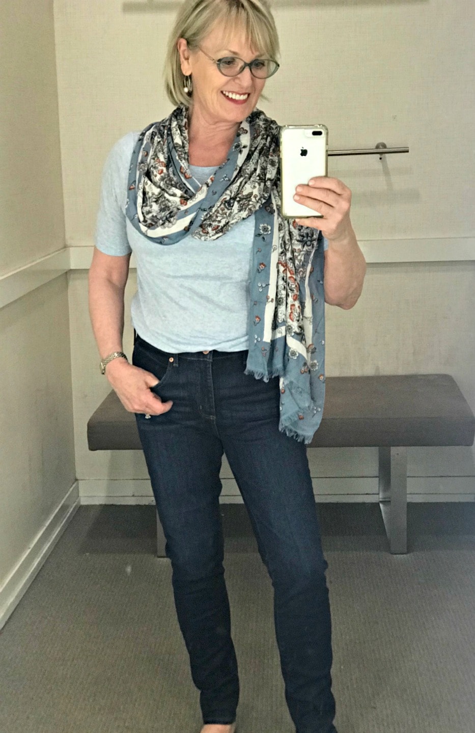 causal outfit of blue tee, jeans and floral scarf on Jennifer Connolly of A Well Styled Life