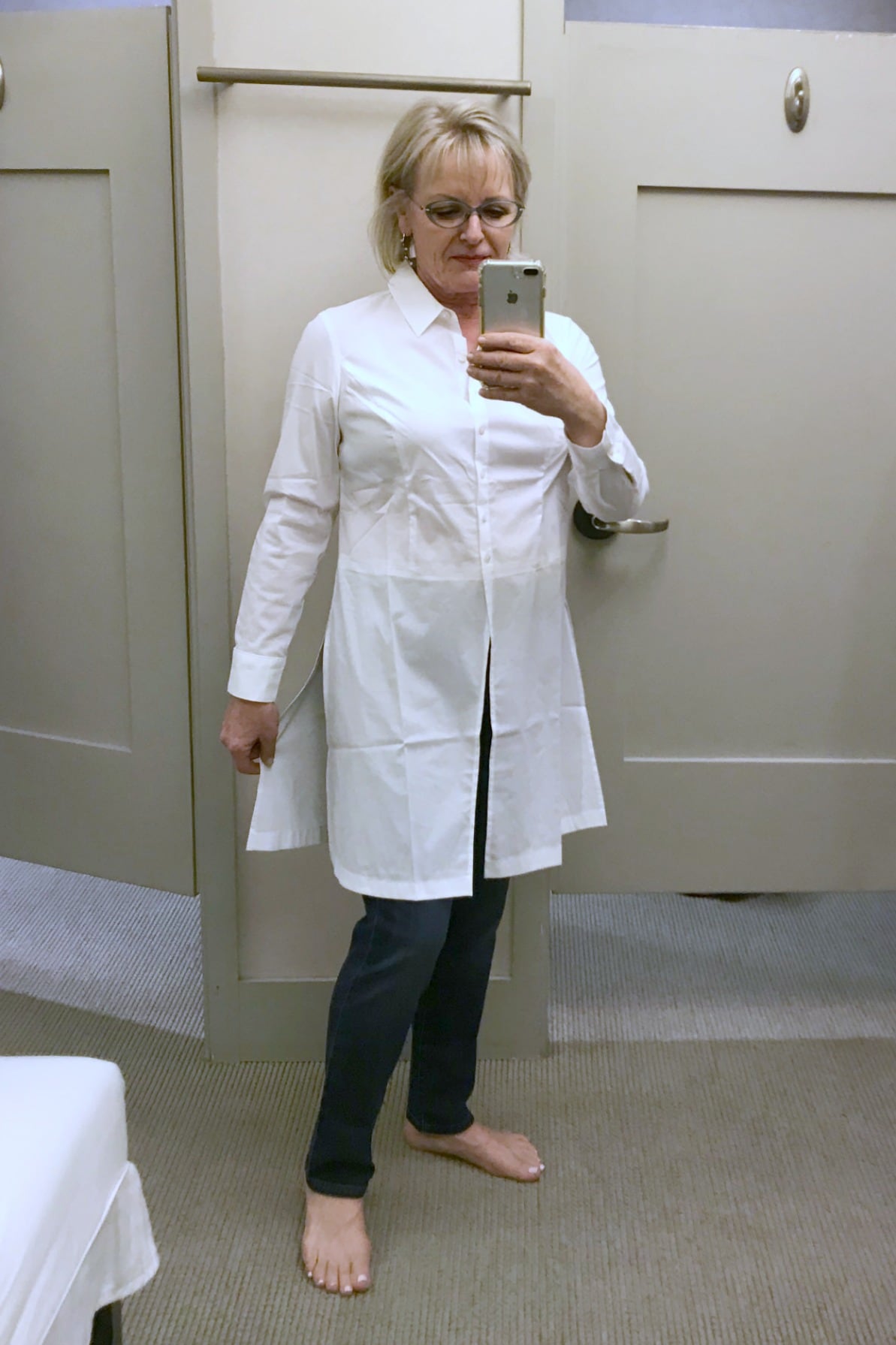 Jennifer Connolly trying on white tunic by Cristian Siriano for j.jill