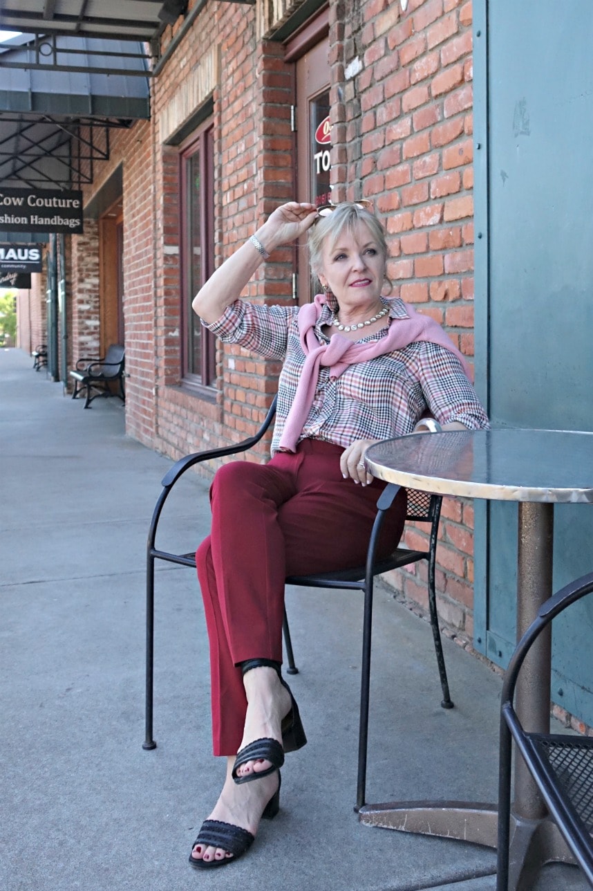 casual outfit on Jennifer Connolly of A Well Styled Life with pink sweater and red pants
