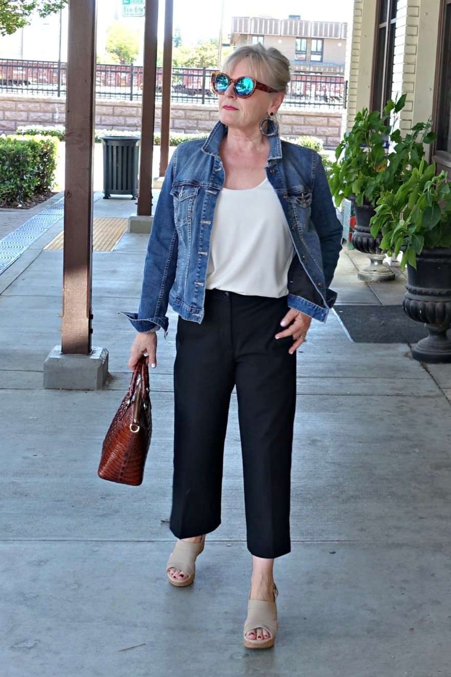 Jennifer Connolly of A Well Styled Life wearing wide cropped pants and denim jacket