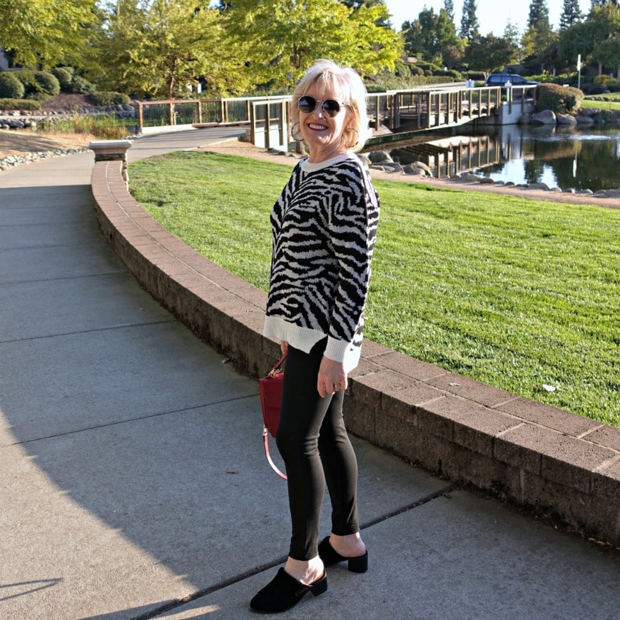 leopard sweater with black jeggings and red crossbody from Walmart on A Well Styled Life